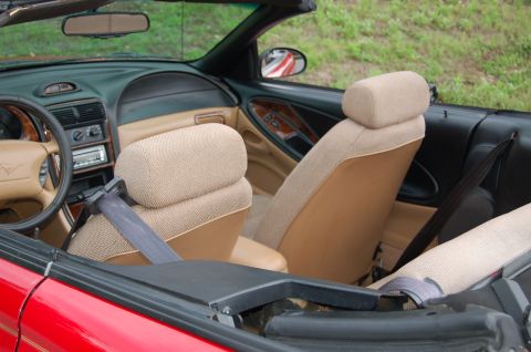 2001 Ford Crown Victoria - The tan fabric seats and interior trim are visible in this convertible's cabin.
