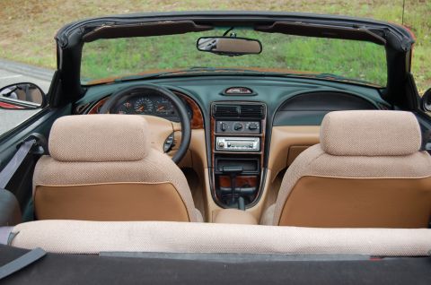 2001 Ford Crown Victoria - Interior view of a 1996 Ford Mustang convertible, showing the dashboard, seats, and center console.