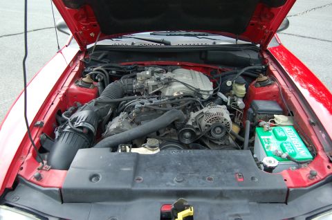 2001 Ford Crown Victoria - Engine bay of a 1996 Ford Mustang, showing the V8 engine and associated components.