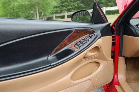 2001 Ford Crown Victoria - Close-up of the interior door panel, wood trim and power window controls.