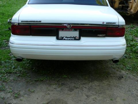1997 Mercury Grand Marquis - Rear view of a 1997 Mercury Grand Marquis, its dual exhaust system and 'SCT' badging.