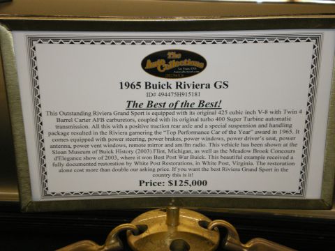 1998 Ford Crown Victoria - Dealer/museum sales display card describing a 1965 Buick Riviera GS with specifications, history, and a $125,000 price.