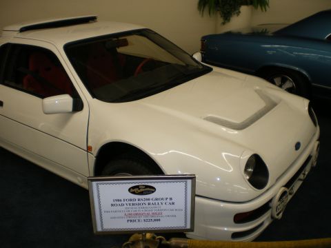 1998 Ford Crown Victoria - White Ford RS200 Group B coupe on museum display with a placard identifying it as a 1986 road-version rally car.