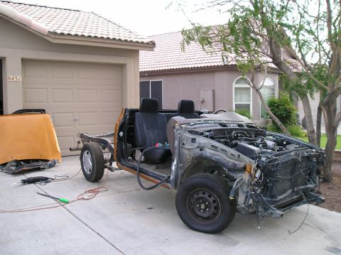 1986 Toyota Hilux - This 1986 Toyota Hilux is in a state of disassembly, with its engine and chassis clearly visible.