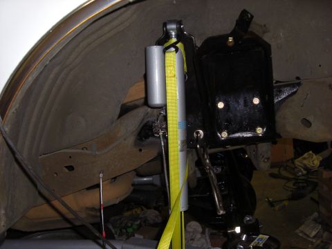 1993 Ford Bronco - Close-up view of a vehicle's suspension component, likely during modification or repair.