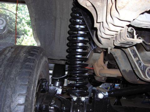 1993 Ford Bronco - Custom suspension parts are visible on this off-road vehicle's undercarriage.