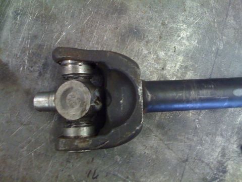 1966 Ford Bronco - Close-up of a driveshaft universal joint, possibly from a 1966 Ford Bronco, showing wear and tear.
