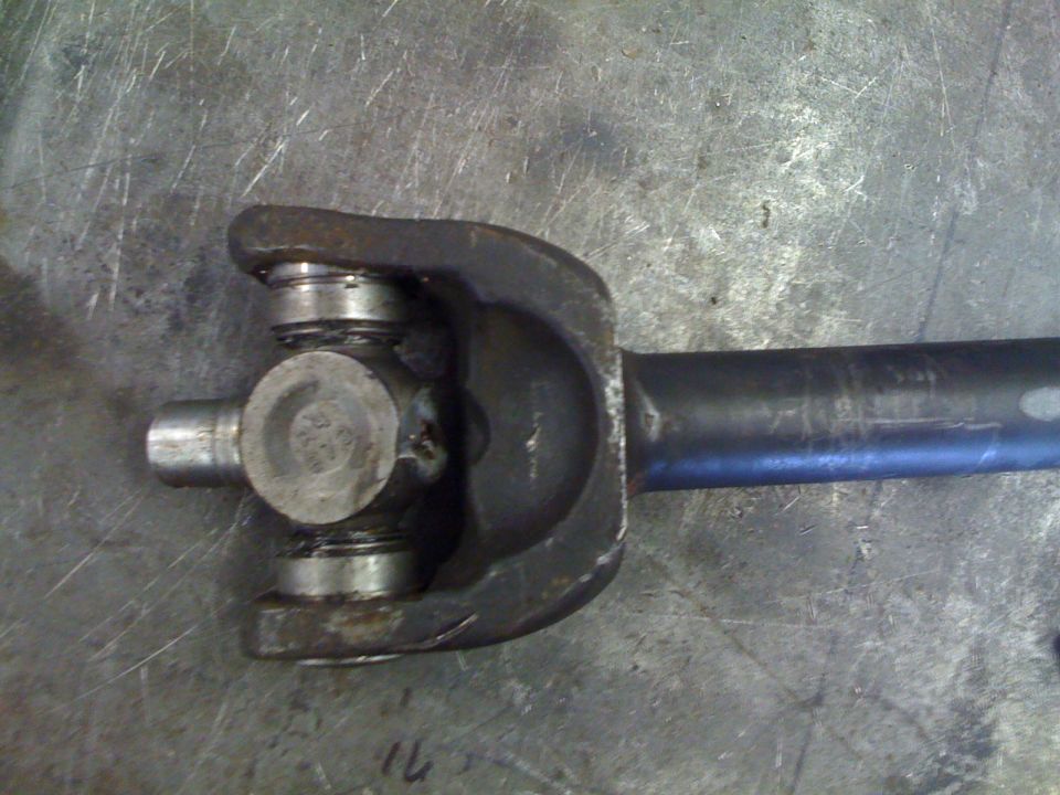 Driveshaft universal joint with visible part numbers