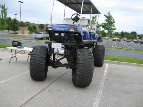 1994 Ford Bronco - This modified golf cart features oversized tires and a lifted suspension, with 'MEMPHIS' visible on the front.