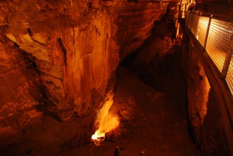 1996 Ford Bronco - A view inside a cave, showing natural rock formations and a man-made walkway for visitors.