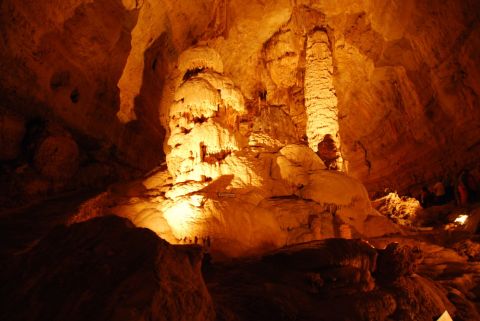 1996 Ford Bronco - Illuminated cave formations create a dramatic subterranean landscape.