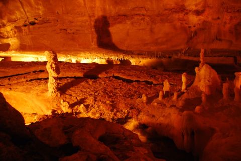 1996 Ford Bronco - A natural cave scene displays various rock formations under warm, artificial lighting.