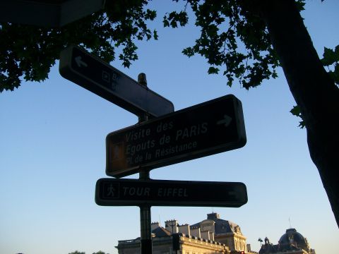 2008 Citroen Xantia - Street signs in Paris indicate directions to the Eiffel Tower and the Paris Sewers Museum.