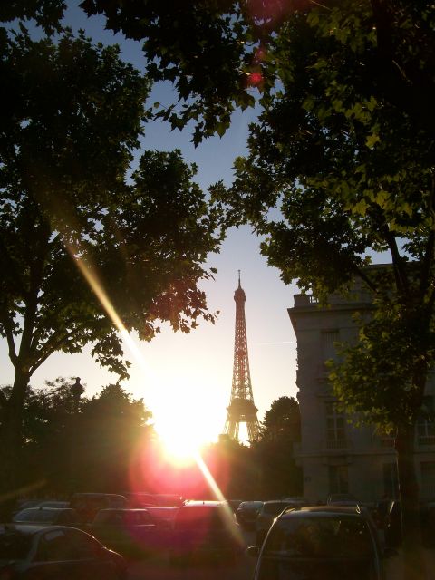 2008 Citroen Xantia - Sunset over Paris with the Eiffel Tower and parked cars visible.