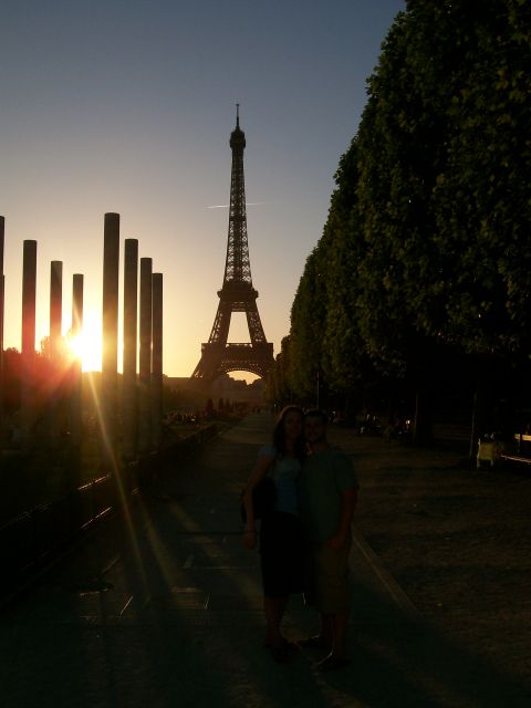 2008 Citroen Xantia - A couple poses for a photo in front of the Eiffel Tower during a sunset in Paris.