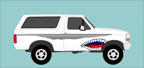 1995 Ford Bronco - A white Ford Bronco from the early to mid-1990s is depicted with a shark mouth graphic.