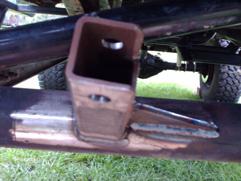 1982 Ford F-100 - Close-up of a welded metal bracket on a vehicle's frame, with the Supermotors logo visible at the bottom right.