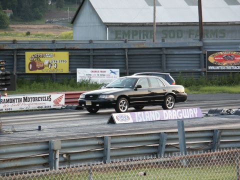 2001 Mercury Grand Marquis - A black 2001 Mercury Grand Marquis is seen on the drag strip at Island Dragway.