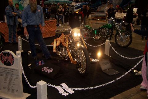 1970 Ford Ranchero - Custom motorcycle with skeleton rider and a second motorcycle on display at an event.