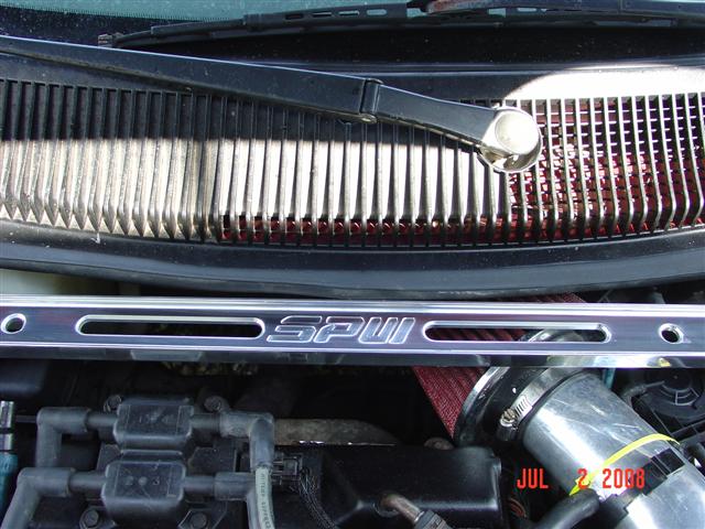 Engine bay showing a chrome strut bar with 'SPU' visible, red air filter, and a date stamp 'JUL 2, 2008'