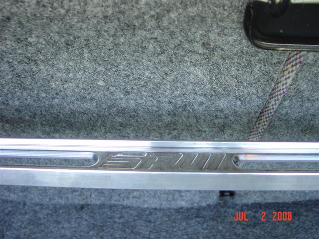 Interior trim with engraved text 'SRT-4' and a date stamp 'JUL 2 2008'