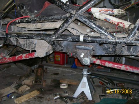 1984 Ford Bronco - Close-up view of a heavily modified vehicle frame, a roll cage and suspension components, with a date stamp of 06/18/2008.