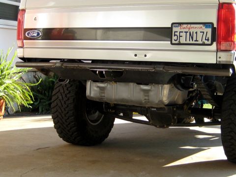 1996 Ford Bronco - Rear view of a modified Ford Bronco, showing its aftermarket bumper and drivetrain components.