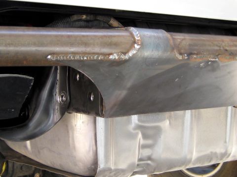 1996 Ford Bronco - This photo shows a custom-welded bracket attached to the vehicle's frame, positioned above the fuel tank.