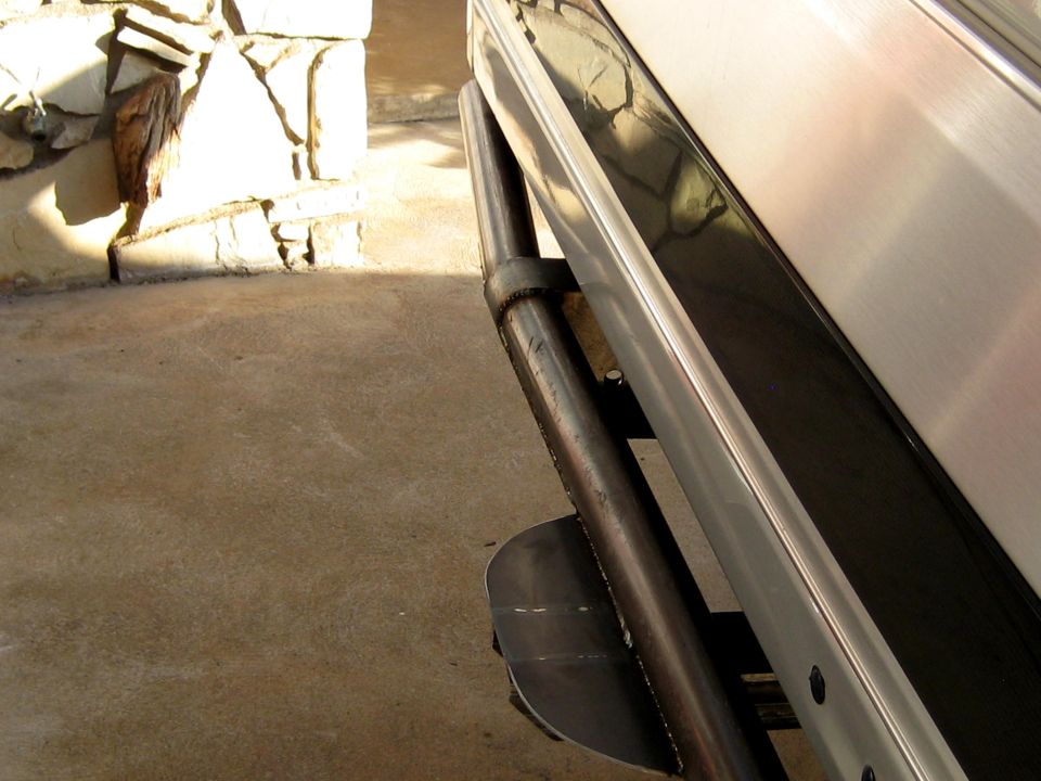 Rear bumper with dual tube protection and a metal skid plate