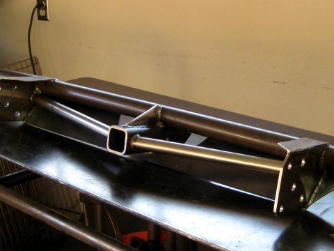 1996 Ford Bronco - Custom steel bumper fabrication shown on a workbench.