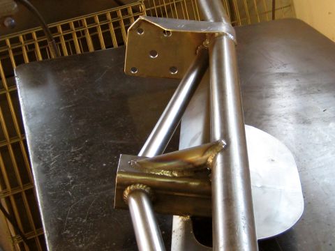 1996 Ford Bronco - Close-up view of a fabricated metal structure, likely a custom part, showing welded connections.