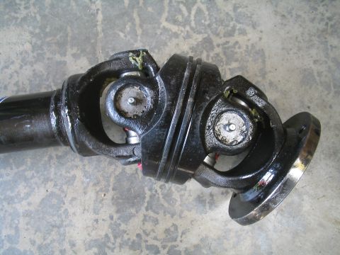 1979 Ford Bronco - Close-up of a driveshaft assembly, showing the universal joints and flange.