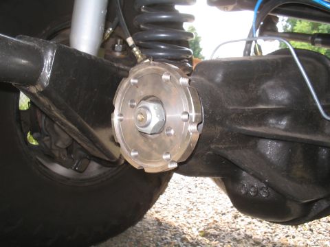 1979 Ford Bronco - Detail of a rear axle assembly, showing a custom metal plate and casting numbers.
