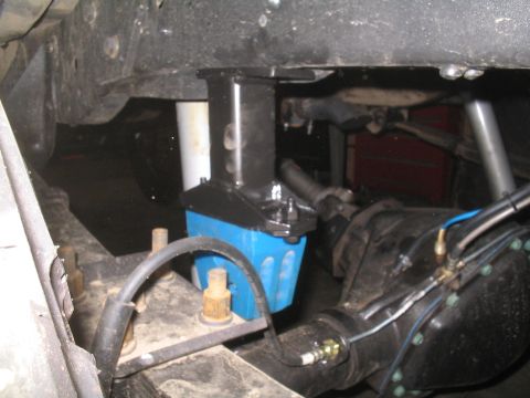 1979 Ford Bronco - Close-up of a modified suspension system, likely for off-road use, showing a blue component and differential.