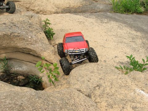 1996 Ford Bronco - An RC truck navigates a rocky terrain, its off-road capabilities.