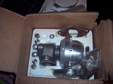 1995 Ford Probe - A new wastegate kit is shown inside its shipping box, ready for installation.