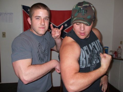 1996 Ford Bronco - Two men pose for a photo in front of a Confederate flag, one flexing his arm and the other making a hand gesture.