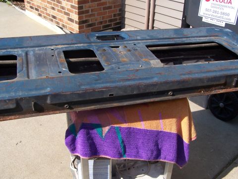1986 Ford Bronco - This is a tailgate panel, possibly from a Ford Bronco, showing signs of rust and wear.