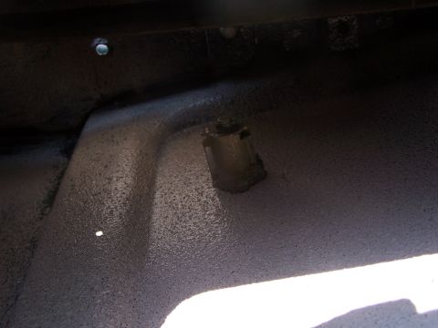 1986 Ford Bronco - A close-up view of a tailgate latch mechanism is visible, with the Supermotors.net logo in the lower right corner.