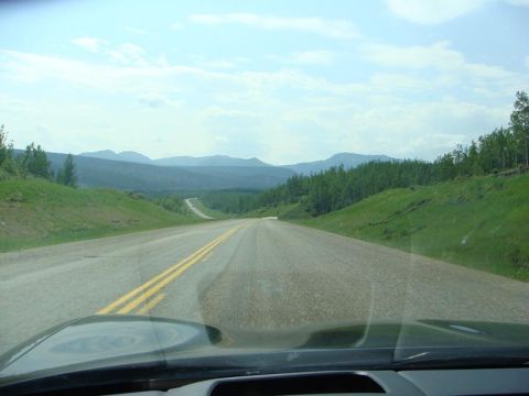 2001 Chevrolet Corvette - Driving on a highway through a scenic mountain and forest area.