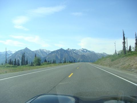 2001 Chevrolet Corvette - A scenic drive on a highway with mountains in the distance.