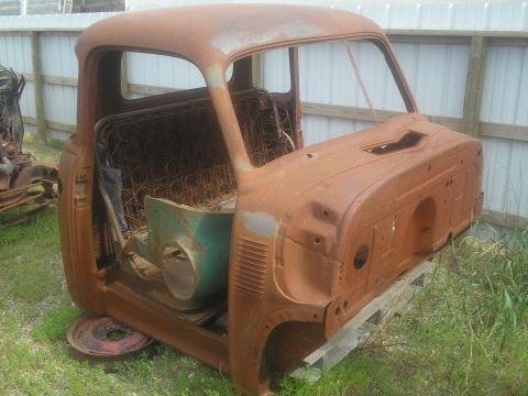 1951 Chevrolet C/K Pickup - This heavily rusted truck cab is missing its front end and bed, with only the interior and part of the firewall remaining.