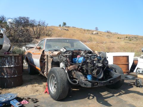 1975 Ford Ranchero - This 1975 Ford Ranchero is in a state of disassembly, with its engine fully exposed.
