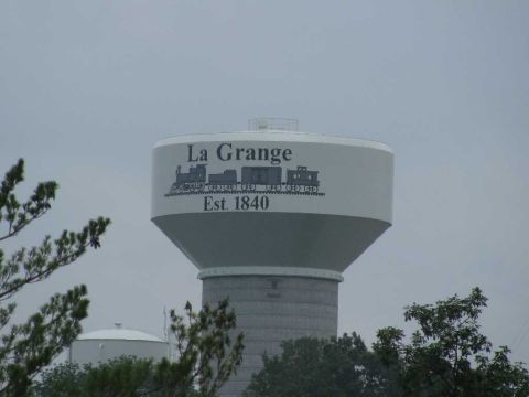 2003 Mercury Marauder - A water tower in La Grange, established in 1840, is visible against a cloudy sky.