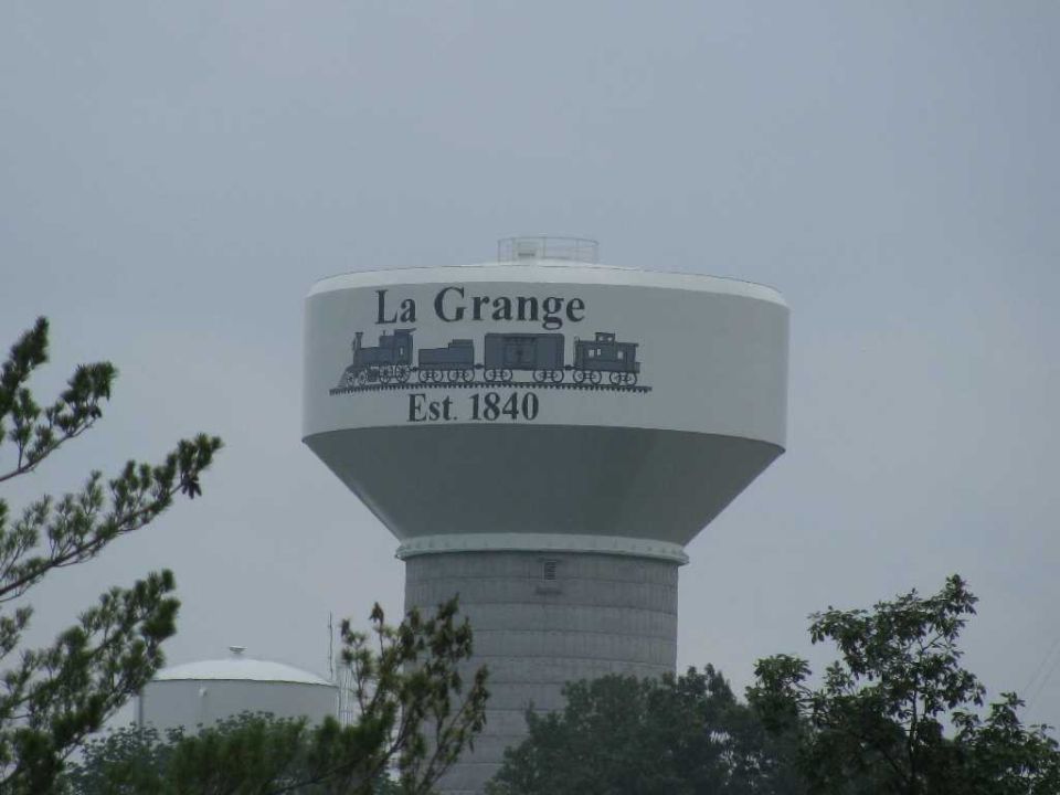 Water tower with 'La Grange Est. 1840' and train graphic