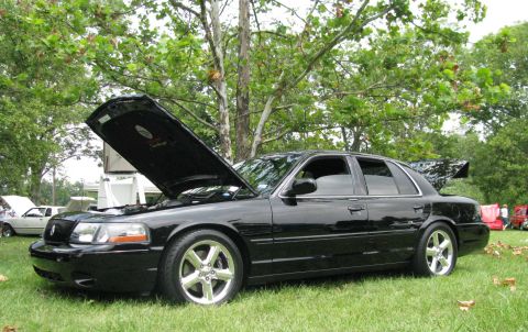 2003 Mercury Marauder - Black 2003 Mercury Marauder at a car show with hood and trunk open.