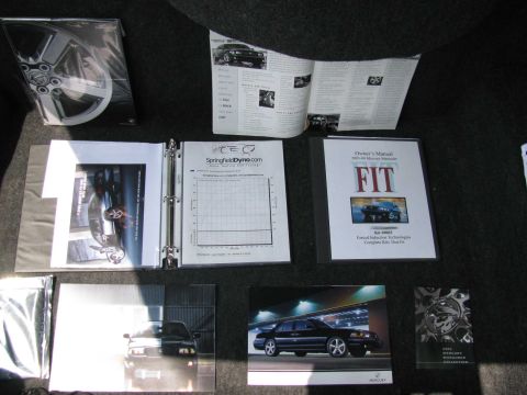 2003 Mercury Marauder - Collection of documents and photos related to a Mercury Marauder, including an owner's manual.