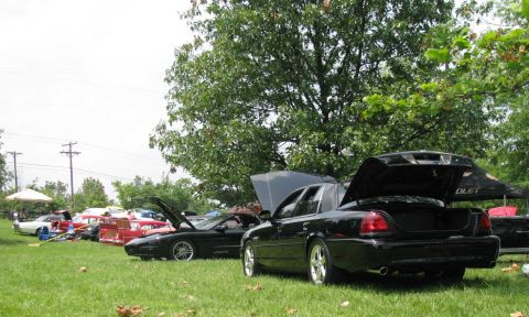 2003 Mercury Marauder - A black 2003 Mercury Marauder is displayed with its trunk open at an outdoor car show.