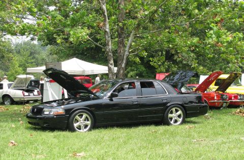 2003 Mercury Marauder - A black 2003 Mercury Marauder is displayed with its hood open at an outdoor car show.