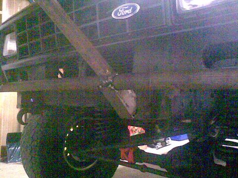 1984 Ford Bronco II - Close-up of a Ford vehicle's front end, focusing on the grille and a custom-mounted bar.
